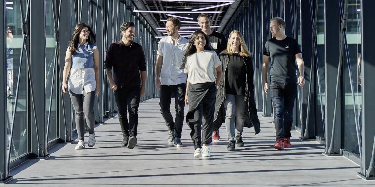 people walking on the PUMA bridge