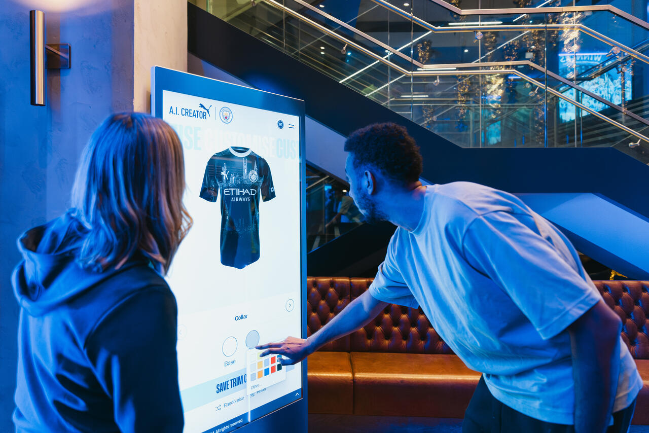 A fan interacting with the Manchester City kit designer