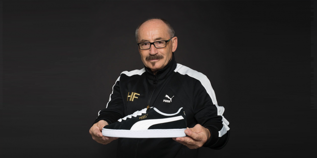 PUMA Employee holding a shoe